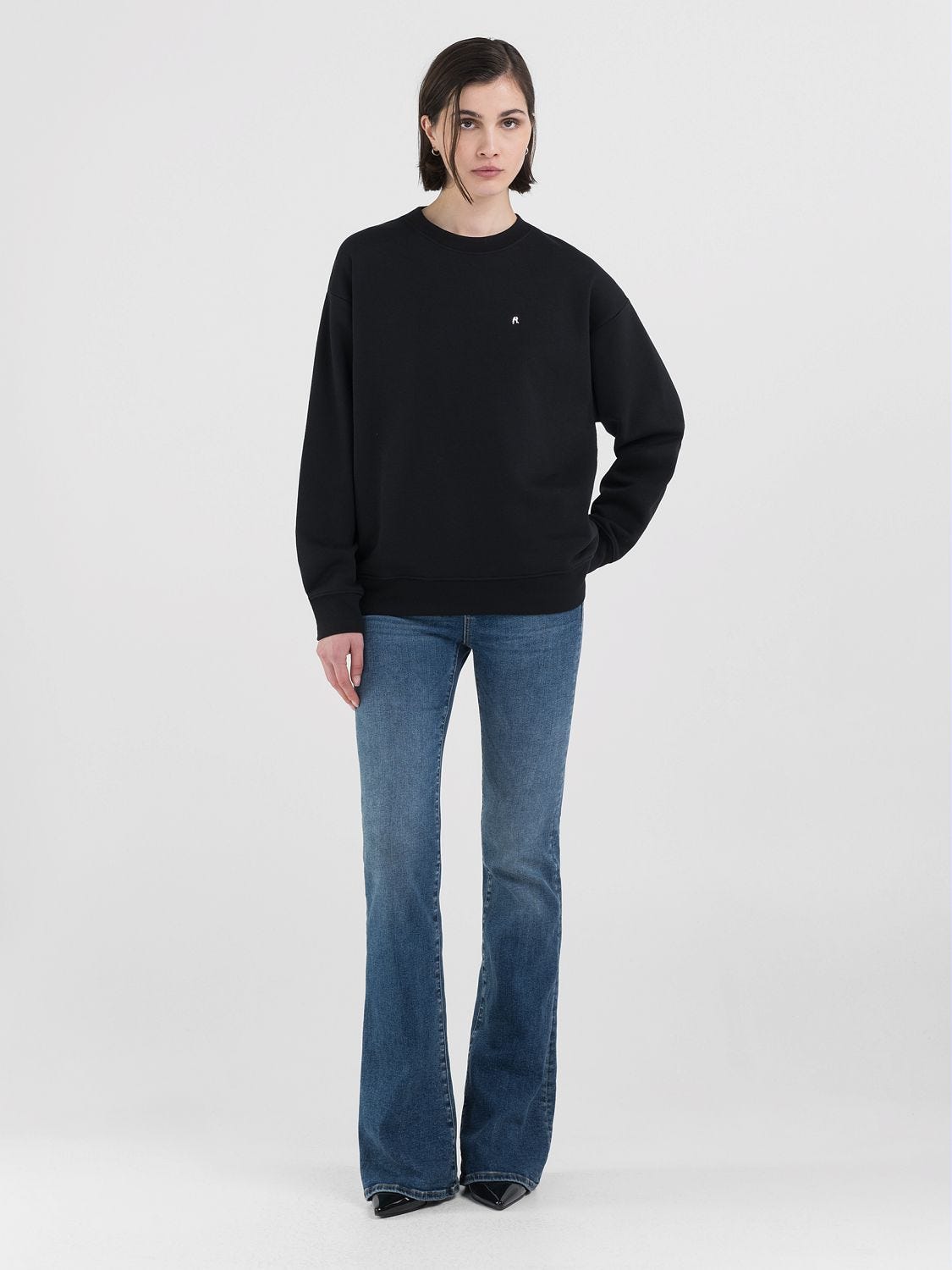 Black sweatshirt and jeans top