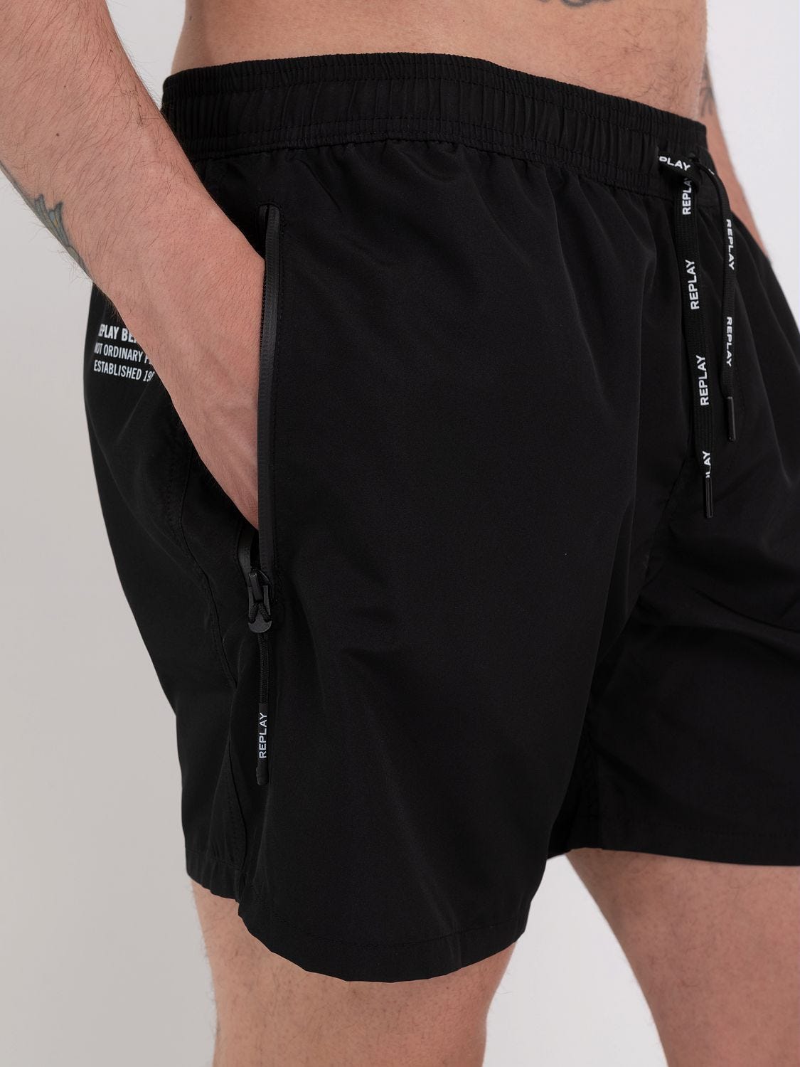 Swimming trunks with zipped pocket