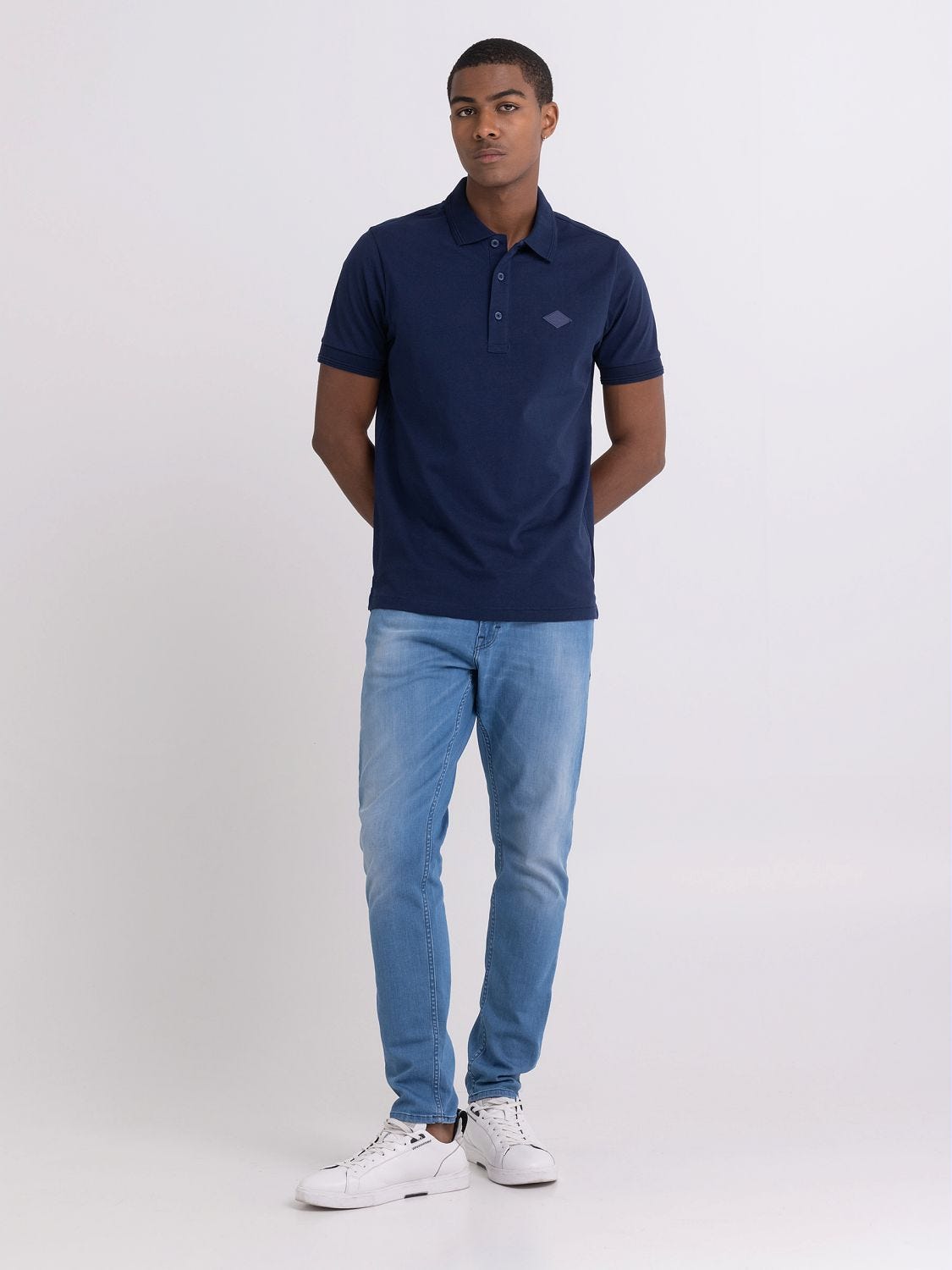 Polo shirt with shop jeans and sneakers